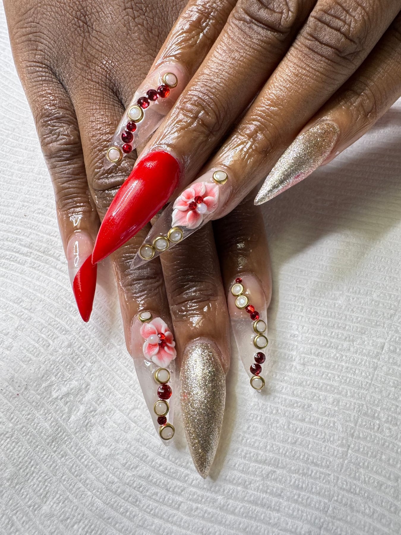 Red and bare nails with floral accents