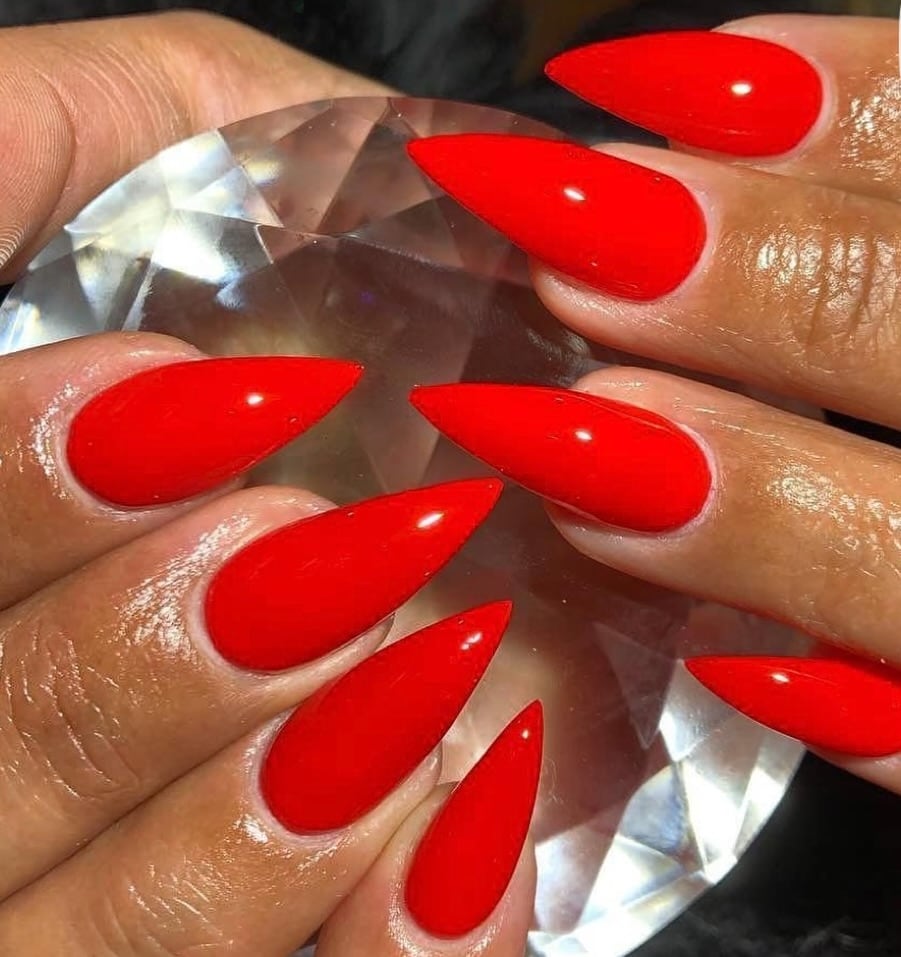Glossy red stiletto nails